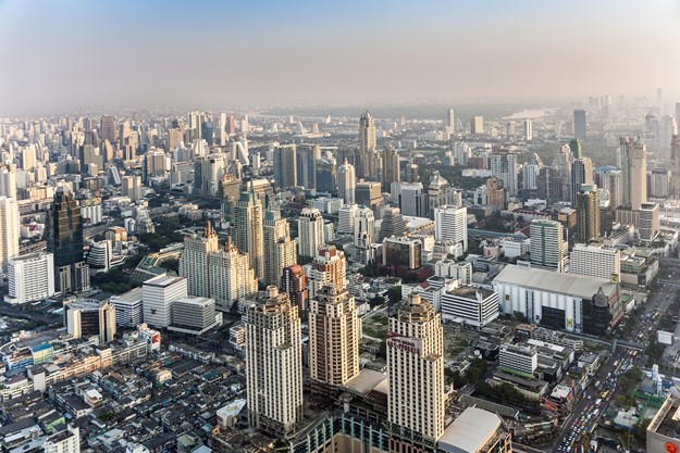 view to skyline of Bangkok in late afternoon with highways and