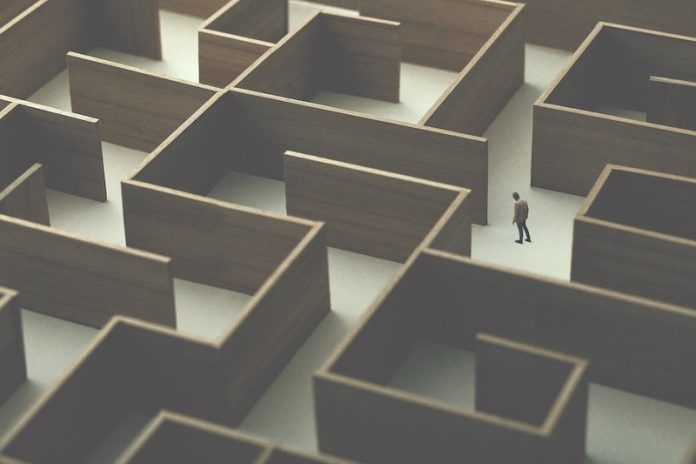 Man,Walking,In,A,Big,Complex,Labyrinth,,Surreal,Concept