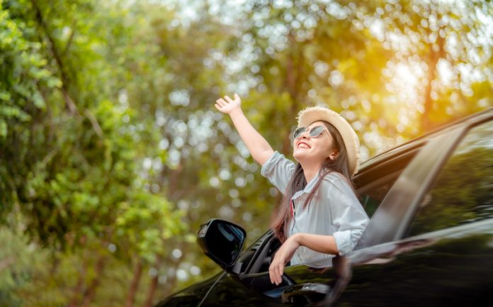 Enjoy Car travel of woman driving with sunglasses journey at nature forest in summer vacation road trip on holidays to destination, Traveler transportation vehicle people lifestyle