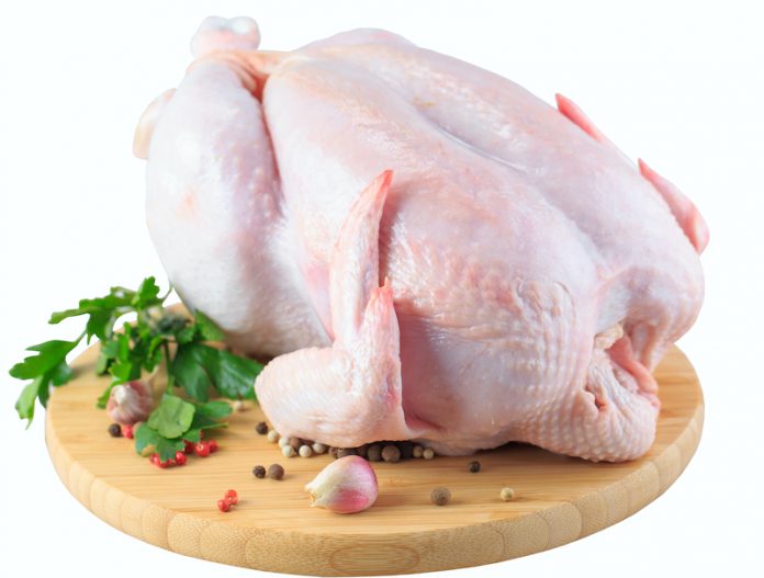 Raw,Chicken,Carcass,On,The,Cutting,Board,Isolated,On,White