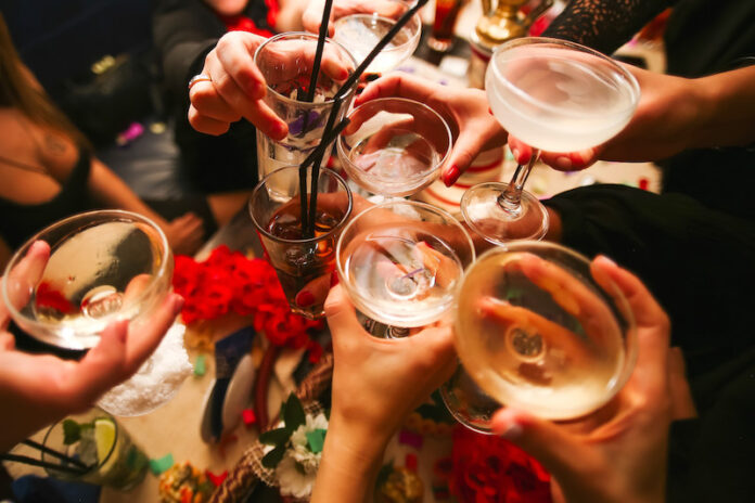 Clinking glasses and toasting